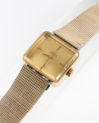 A gentleman's gilt Omega Deville automatic wristwatch on a ditto bracelet