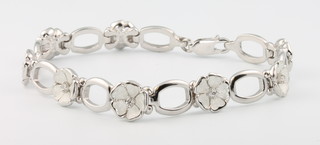 A Nicole Barr silver, enamel and diamond flower bracelet 