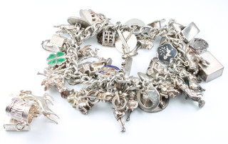A silver charm bracelet, 130 grams