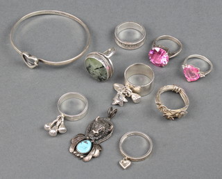 8 silver rings, a bangle and pendant, 70 grams 