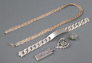 A silver identity bracelet, necklace, brooch, ingot and ring, 119 grams