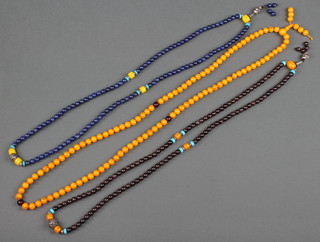 A string of lapis beads and 2 other necklaces