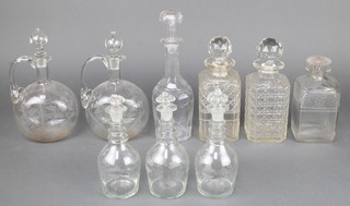 3 Continental decanters with ring necks and simple vinous decoration, a pair of ewers, 2 square shaped decanters and stoppers, a mallet shaped decanter and stopper and a square ditto 