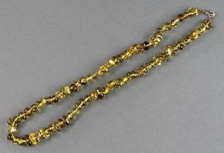 A string of green amber beads 18"
