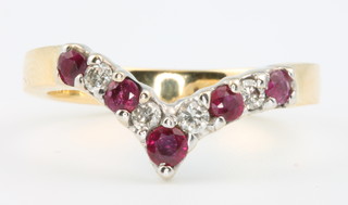 An 18ct yellow gold ruby and diamond wishbone ring size Q