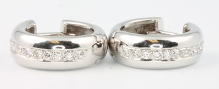 A pair of 18ct white gold diamond set hoop earrings 