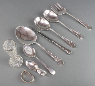 A pair of silver serving spoons, Sheffield 1917, ditto napkin ring and minor cutlery 190 grams 