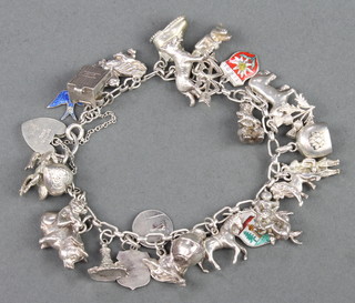 A silver charm bracelet, 69 grams