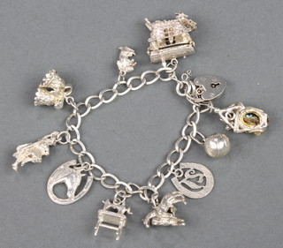 A silver charm bracelet 36 grams