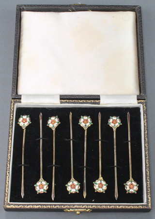 A set of 8 silver cocktail picks with Tudor Rose enamelled decoration, cased 