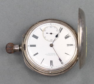 A silver hunter pocket watch with seconds at 6 o'clock, the dial inscribed T R Russell Liverpool