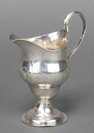 A George III silver cream jug with chased armorial and floral decoration, London 1786, 86 grams 4 1/2"