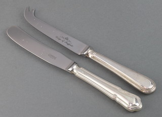 A silver handled butter knife and cheese knife
