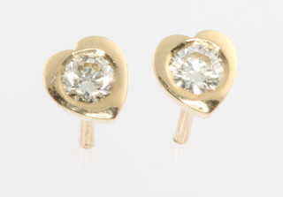 A pair of 18ct yellow gold heart shaped diamond ear studs 