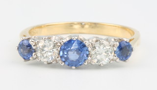 An 18ct yellow gold sapphire and diamond 5 stone ring, size P 1/2 