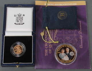A half sovereign 1996, boxed and a gilt crown 2014 