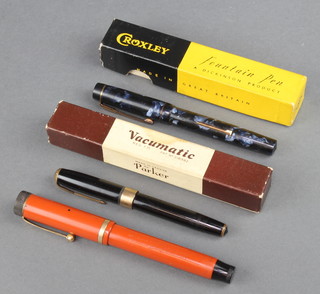 A 1930's Parker Duofold lucky curve orange and black cased fountain pen, a black Parker Vacumatic fountain pen boxed, a blue marbled Croxley pen boxed