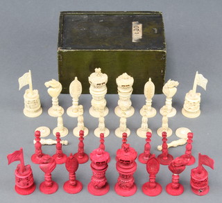 A carved Cantonese stained bone chess set with floral decoration, the king 3" 