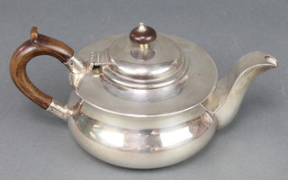A silver baluster squat tea pot with fruitwood mounts London 1916 Maker Holland, Aldwinckle & Slater gross 18 oz