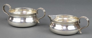An Edwardian silver cream jug and sugar bowl London 1908 maker Holland, Aldwinckle & Slater 9 oz