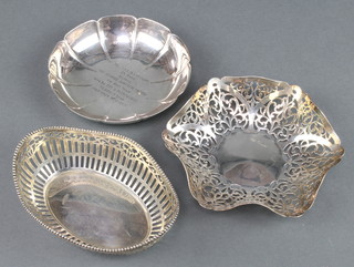 A silver lobed dish with presentation inscription Sheffield 1966 a pierced silver dish Sheffield 1967 and a continental silver dish 10 oz