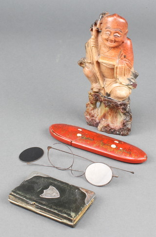 A Victorian silver mounted leather aide memoire, a soapstone figure and a pair of spectacles in a chinoiserie case
