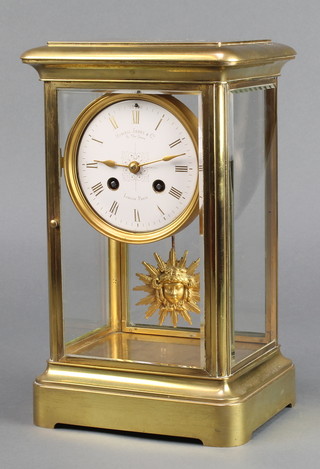 Howell James & Co.  A 19th Century French 8 day striking 4 glass clock, contained in a gilt case 