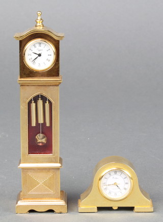 An Everite miniature battery operated quartz model longcase clock contained in a gilt case 4 1/2" and a ditto timepiece contained in an Admiral's hat shaped case 1"