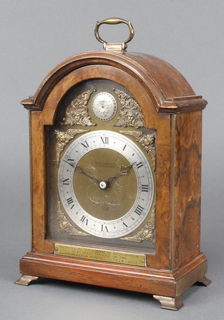 Elliott, a Queen Anne style bracket clock with arched gilt dial and silvered chapter ring, contained in a walnut case 
