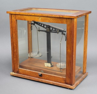 Philip Harris, a pair of laboratory scales contained in an oak case 17" x 10" x 18" 