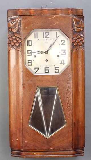 O D O, a French Art Deco 8 day chiming wall clock with rectangular silvered dial and Arabic numerals contained in a mahogany case 