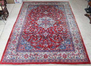 A red and blue ground Persian Sarough rug with central medallion 129" x 96" 