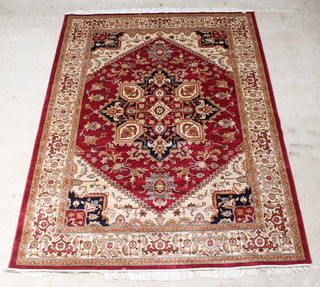 A Belgian cotton Heriz Persian style red and gold ground carpet with central medallion 109" x 79" 