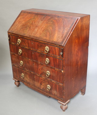 A Georgian mahogany bureau, the crossbanded fall front revealing a fitted interior above 4 long graduated drawers with ring drop handles, raised on bun feet  44"h x 38"w x 20"d 
