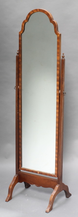 A Queen Anne style arched plate cheval mirror contained in a walnut swing frame 56"h x 15 1/2"w 