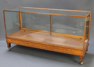 An Art Deco oak shop display cabinet 39"h x 72"w x 24"d (no interior fittings or shelves) 