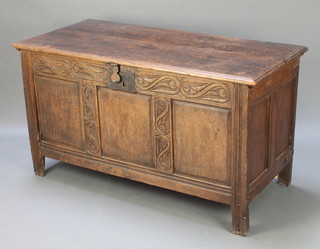 A 17th/18th Century oak coffer of panelled construction, the interior fitted a candle box, with iron lock 27"h x 48"w x 22"d 
