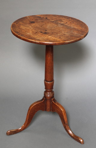 A 19th Century circular oak wine table raised on pillar and tripod base 28"h x 18 1/2" diam 