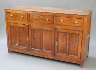 A Victorian pine dresser base fitted 3 drawers above double cupboard 35"h x 62"w x 17"d 