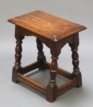 A reproduction oak joined stool raised on turned and block supports 18"h x 18"w x 11"d 