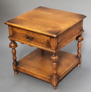 A square oak lamp table fitted a frieze drawer with undertier, raised on bulbous supports 22"h x 22" 