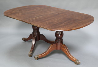 A 19th Century style mahogany D end extending dining table, raised on twin pillar and tripod supports with 2 extra leaves 27"h x 39"w x 59"l x 92" when fully extended 