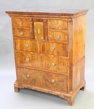 A Georgian inlaid walnut chest with moulded cornice and canted fluted columns to the side, fitted a cupboard enclosed by a panelled door with 2 short drawers above 3 long drawers, inlaid satinwood stringing, raised on bracket feet 50"h x 42"w x 23"d (formerly the top of a chest on chest) 