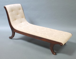 A 19th Century mahogany show frame day bed upholstered in light buttoned material, raised on scroll supports 30"h x 52"w x 20 1/2"d 