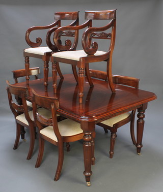 A Georgian style dining room suite comprising a rectangular mahogany extending dining table raised on turned and fluted supports 29"h x 45"w x 60"l x 80" with extra leaf together with 8 bar back dining chairs with carved mid rails and upholstered drop in seats raised on turned and reeded supports 30" h x 59"l (80" with leaf) x 43 1/2"d