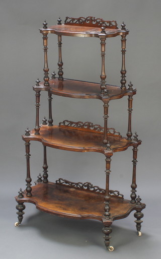 A Victorian inlaid figured walnut 4 tier what-not of serpentine outline, the base 27" x 14", the next  25" x 12", then 22" x 11" and the top 18" x 9"  