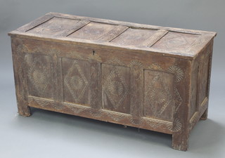 A 17th/18th Century carved oak coffer of panelled construction with hinged lid 23 1/2"h x 49"w x 21"d 