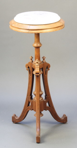 A Victorian turned oak pedestal with white veined marble top, raised on outstretched supports 31"h x 14" diam. 