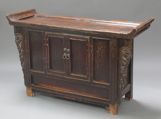 A Chinese hardwood cabinet enclosed by panelled doors 28"h x 46"w x 16"d 