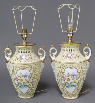 A pair of Continental porcelain 2 handled table lamps with reticulated bodies and painted floral panels 12" 